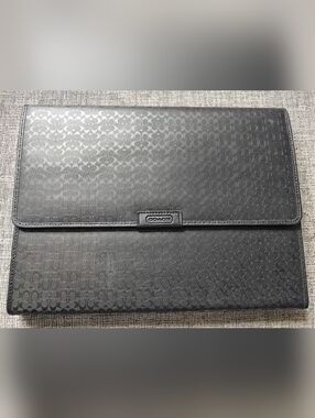 This item is a Coach Heritage Signature Embossed Trifold Portfolio Mobile Office